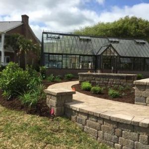 formal English greenhouse with pizza oven, brick herringbone pattern floor, raised beds, walkway, patio and fountain feature - Beaufort