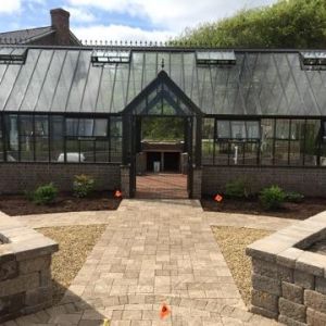 formal English greenhouse with pizza oven, brick herringbone pattern floor, raised beds, walkway, patio and fountain feature - Beaufort
